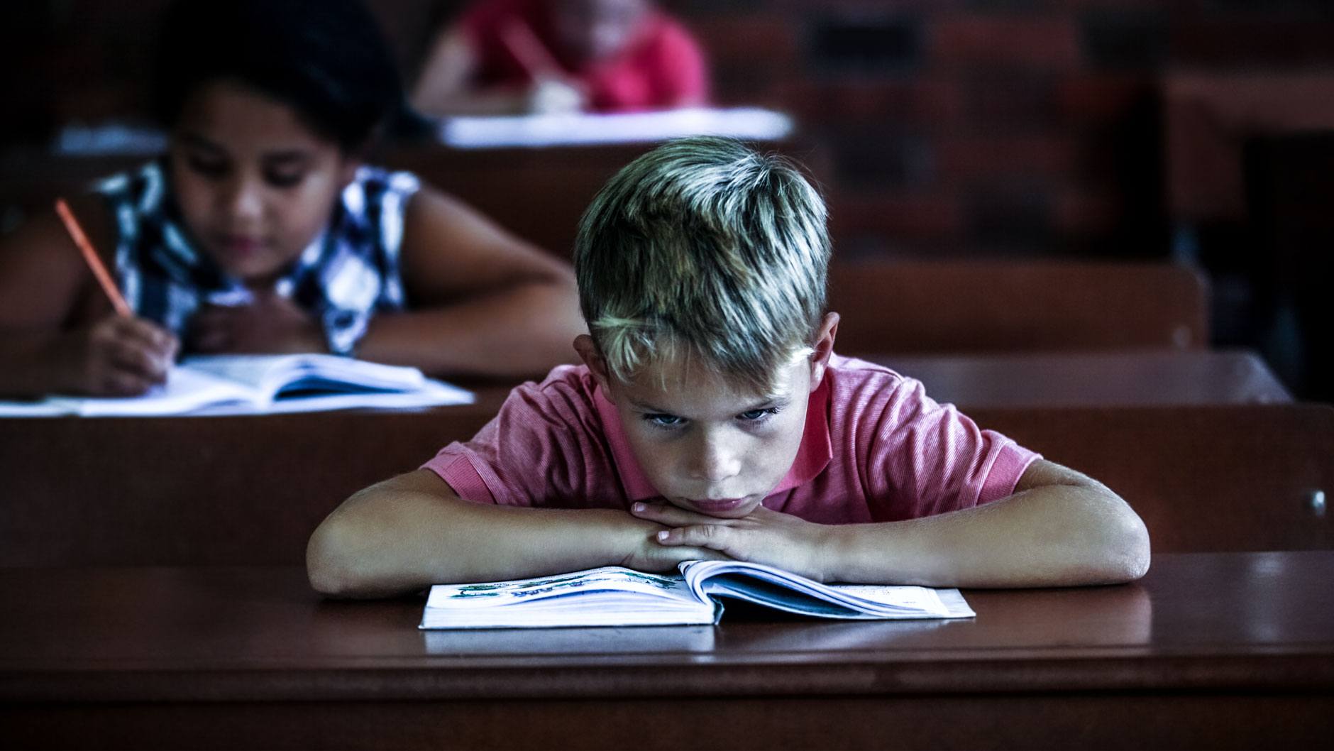 child showing signs of falling behind at school